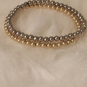TWO 14k white and yellow gold beaded bracelets